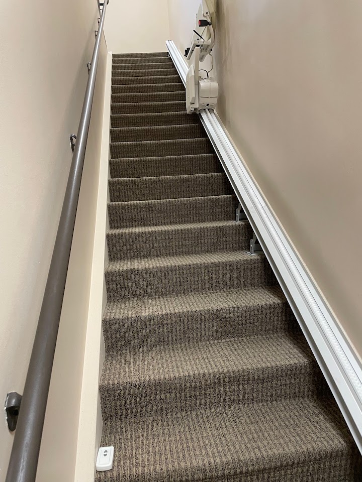 Custom-fit stairlift installed along a staircase