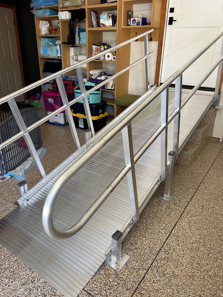Aluminum ramp with handrails installed at a home